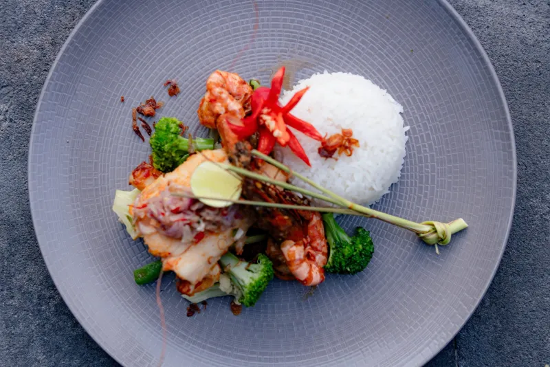 Grilled seafood with rice, broccoli and chili