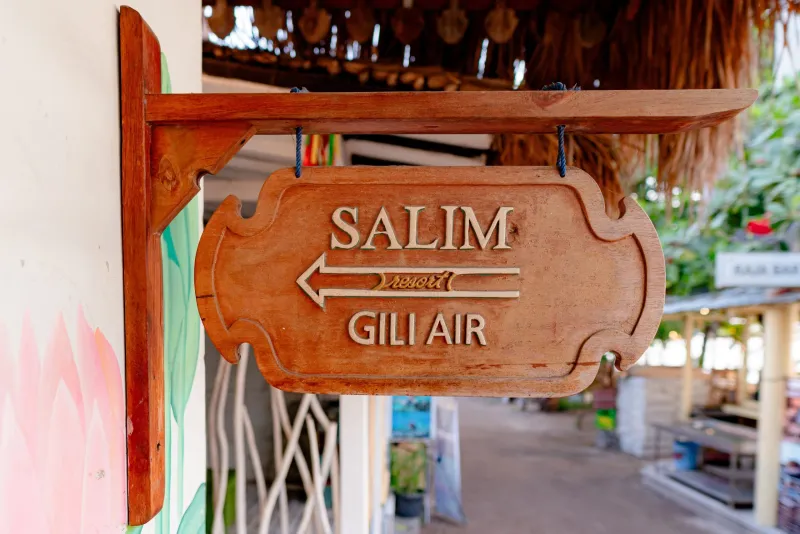 Carved Salim Resort Gili Air direction sign