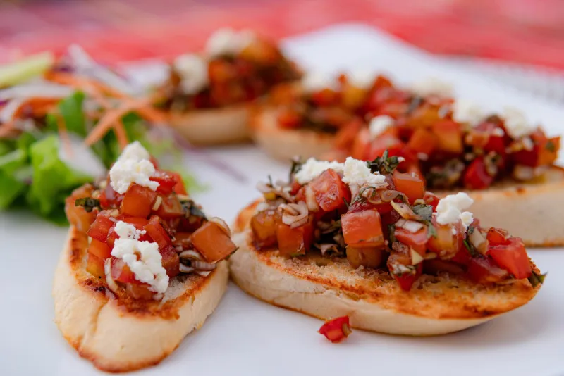 Tomato basil bruschetta topped with feta